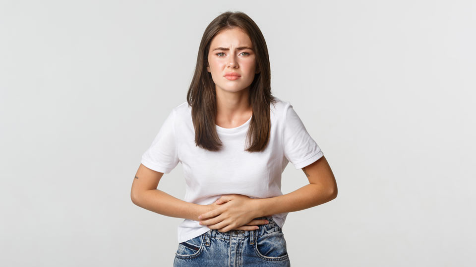 https://www.therapmed.ch/wp-content/uploads/2021/11/woman-having-stomach-ache-with-hands-belly-discomfort-from-menstrual-cramps-girl-feeling-nauseous.jpg